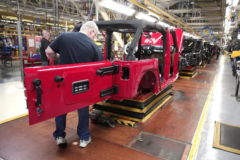 A worker assembles the 2014 Jeep Wrangler at the Chrysler Toledo North Assembly Plant in Ohio. Bill Pugliano / Getty Images / AFP