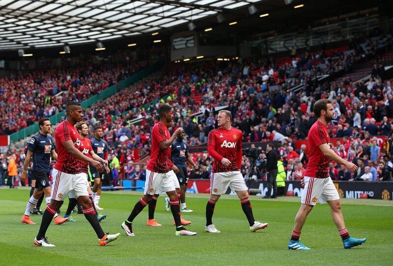 Wayne Rooney of Manchester United leaves the field with team mates before the match was abandoned prior to the Premier League match between Manchester United and AFC Bournemouth at Old Trafford on May 15, 2016 in Manchester, England. (Alex Livesey/Getty Images)