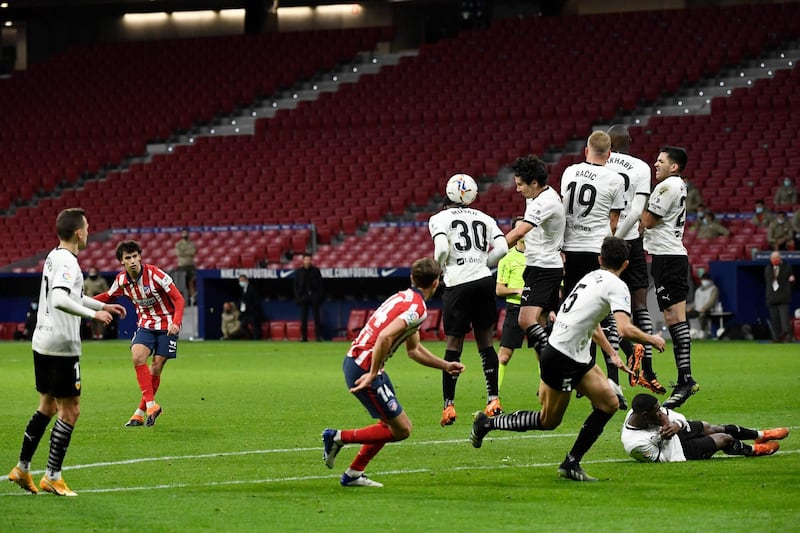 Atletico Madrid's Portuguese midfielder Joao Felix shoots a free kick. AFP