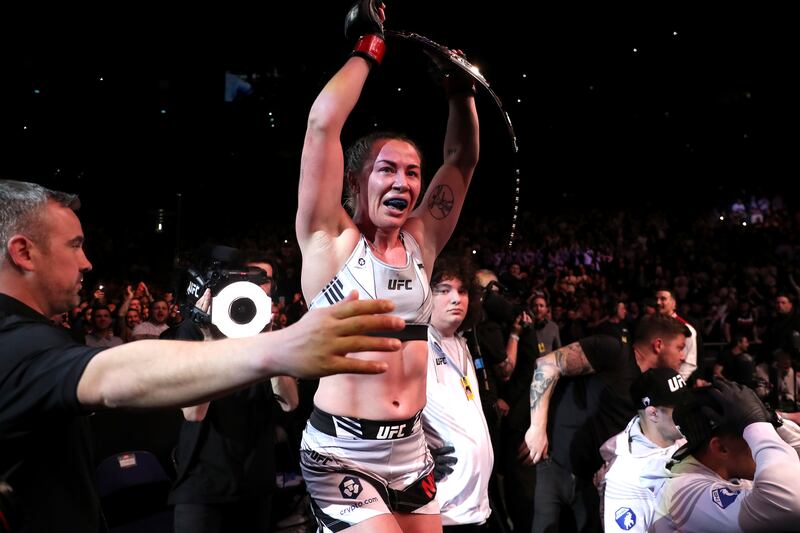 Molly McCann celebrates victory after knocking out Luana Carolina. PA