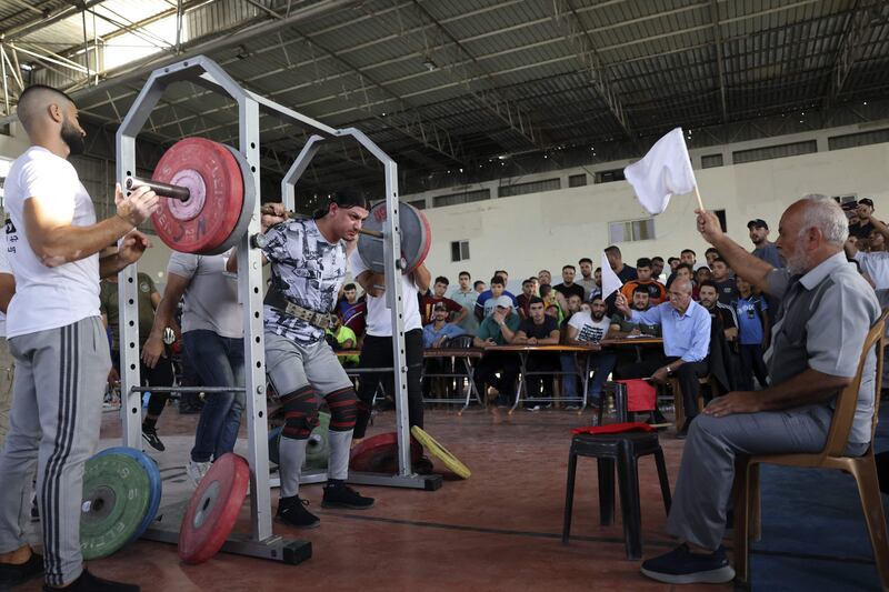 A Palestinian takes part in a weightlifting championship in the southern Gaza Strip town of Khan Yunis. 