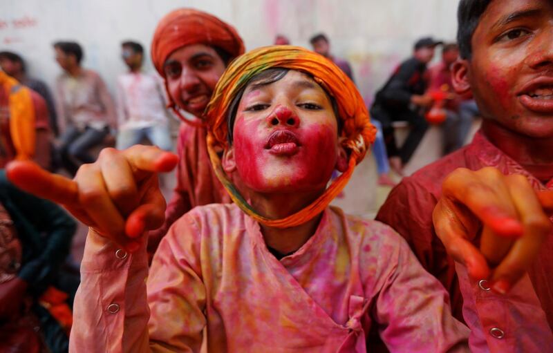 Hindu devotees take part in the religious festival of Holi inside a temple in Nandgaon village, in the state of Uttar Pradesh, India, March 5, 2020. Reuters
