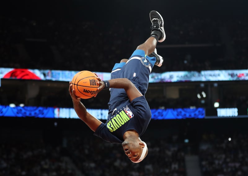 Trick shot artists perform during the game between the Minnesota Timberwolves and Dallas Mavericks in a pre-season NBA game as part of the Abu Dhabi Games 2023. Etihad Arena, Abu Dhabi. Chris Whiteoak / The National