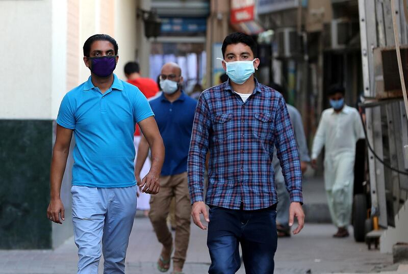 DUBAI, UNITED ARAB EMIRATES , April 27 – 2020 :- People walking on the streets in Al Ras area in Deira Dubai. Authorities ease the restriction for the residents after almost a month long locked down of Al Ras district. (Pawan Singh / The National) For News/Standalone/Online/Instagram