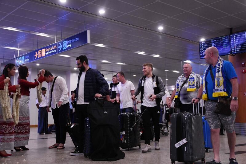Members of Leeds United FC arrive in Yangon international airport on May 8, 2018. 
 Leeds United arrived in Myanmar May 8 to kick off an end-of-season tour mired in controversy over whether the second tier Championship team should be playing in a country that the UN accuses of ethnic cleansing against its minority Rohingya Muslim community. / AFP PHOTO / YE AUNG THU