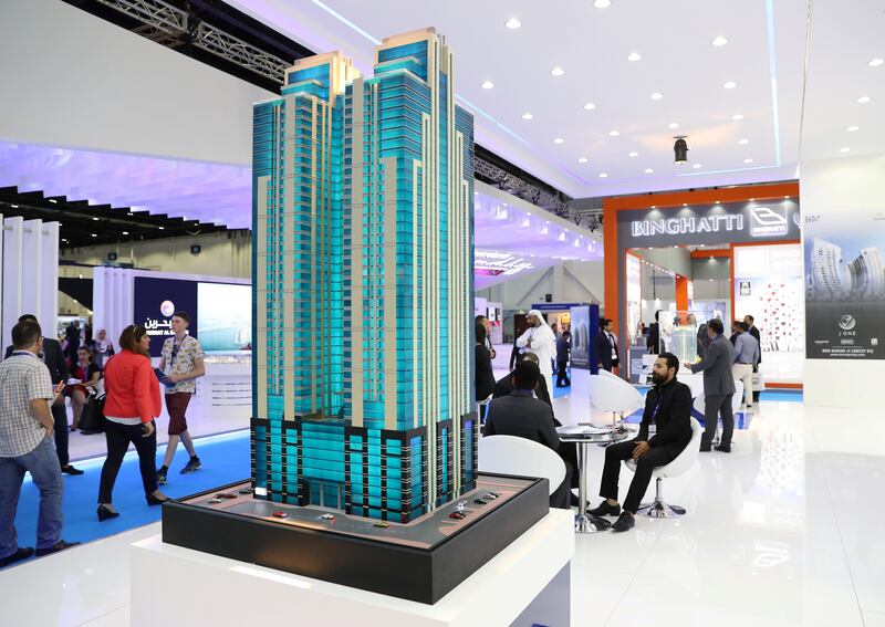 Dubai, United Arab Emirates - September 11th, 2017: Visitors at the Latifa Towers model at 16th addition of Cityscape Global. Monday, September 11th, 2017 at World Trade centre, Dubai. 