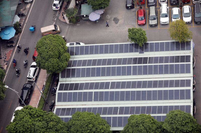 Solar panels on the rooftop of a parking garage in Hanoi, Vietnam. EPA
