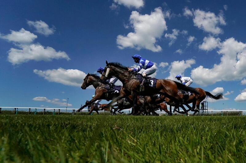 Runners leave the stalls for the first race of the day at Brighton Racecourse in Brighton, England. Getty