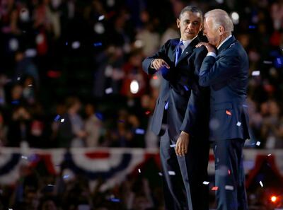 Vice President Joe Biden, right, talks to President Barack Obama at their election night party Wednesday, Nov. 7, 2012, in Chicago. President Obama defeated Republican challenger former Massachusetts Gov. Mitt Romney. (AP Photo/M. Spencer Green)