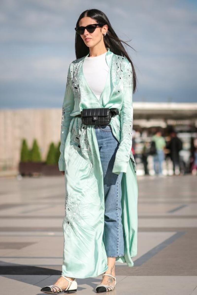 Jeans have become a fashion staple, even in dressed-up looks, as demonstrated by this street style during the recent Paris couture fashion week. Edward Berthelot / Getty Images