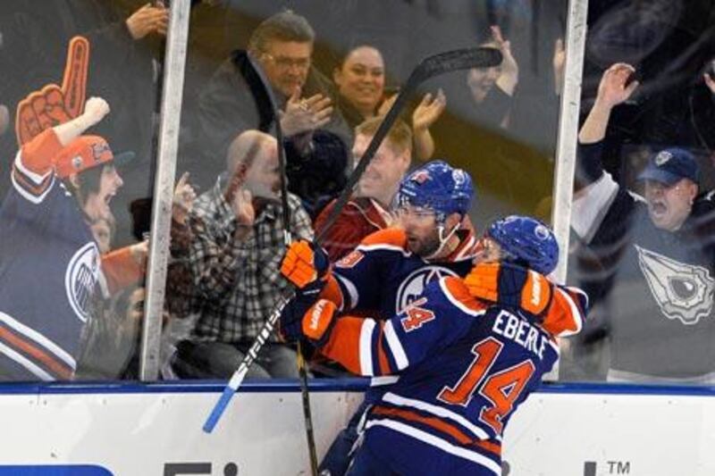 Oilers’ Sam Gagner, left, scored four goals and provided four assists against Chicago.
