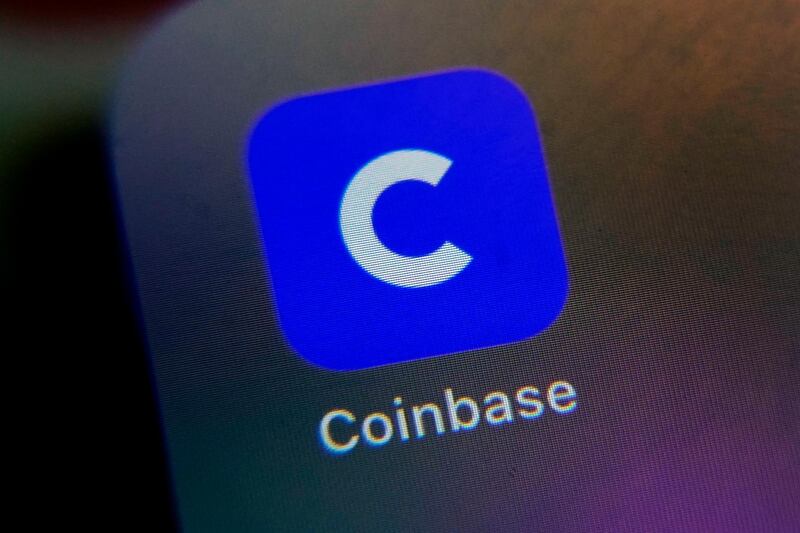 The mobile phone icon for the Coinbase app is shown in this photo, in New York, Tuesday, April 13, 2021. Coinbase is going public at a time when chatter about cryptocurrencies is everywhere, even at the United States Federal Reserve. (AP Photo/Richard Drew)