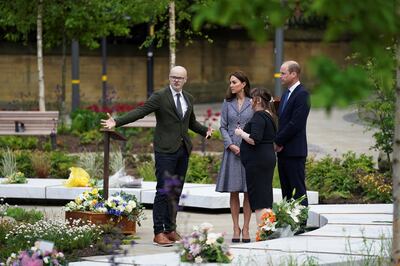 Andy Thomson, memorial designer and director of BCA Landscape, and Joanne Roney, chief executive of Manchester City Council, speak with Britain's Prince William and his wife Catherine as they attend the launch of the Glade of Light Memorial, outside Manchester Cathedral on Tuesday. Reuters