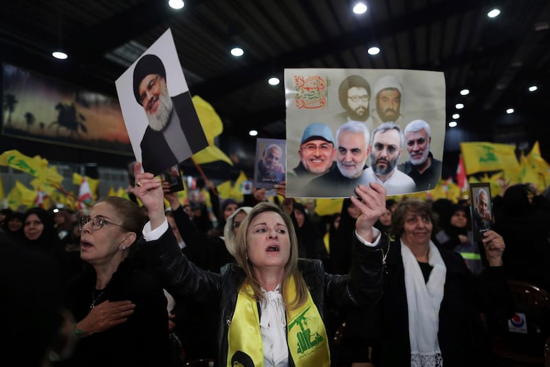 Hezbollah supporters sing the Lebanese and Hezbollah anthems during a ceremony marking the deaths of slain commanders and the Iranian general Qassem Suleimani in the southern suburb of Beirut. AP Photo