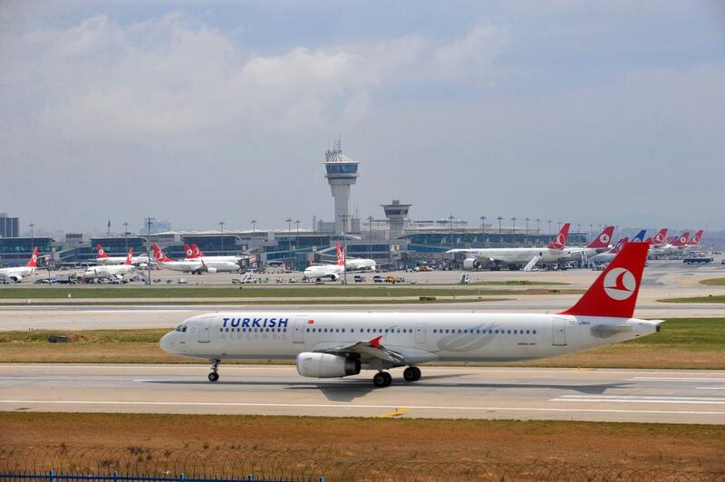 A Turkish Airlines plane takes off at the Ataturk Airport in Istanbul. The carrier has postponed scores of new aircraft. Ozan Kose / AFP