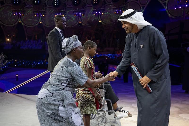 President Sheikh Mohamed greets a participant during the Zayed Sustainability Prize for Climate Action.