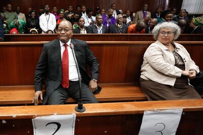 Former South African president Jacob Zuma (L) and accused number two the company Thales represented by Christine Guerrier (R) appear at the KwaZulu-Natal High Court in Durban on April 6, 2018, for a brief preliminary hearing on corruption charges linked to a multi-billion dollar 1990s arms deal. / AFP PHOTO / POOL / Nic BOTHMA