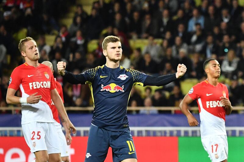 TOPSHOT - Leipzig's German forward Timo Werner (C) celebrates after scoring a goal during the UEFA Champions League group G football match between Monaco and Leipzig at the Louis II stadium, in Monaco, on November 21, 2017. / AFP PHOTO / Bertrand LANGLOIS
