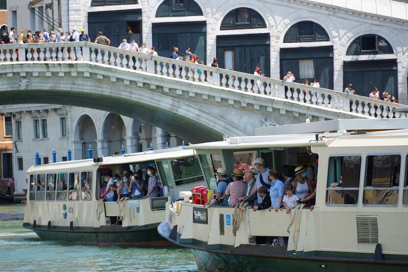Tourists on a public waterbus on the Canal Grande, in Venice, Italy. The Italian Health Ministry announced that the Italian regions of Abruzzo, Liguria, Umbria and Veneto will fall in the low-risk white zone starting June 7th.  EPA