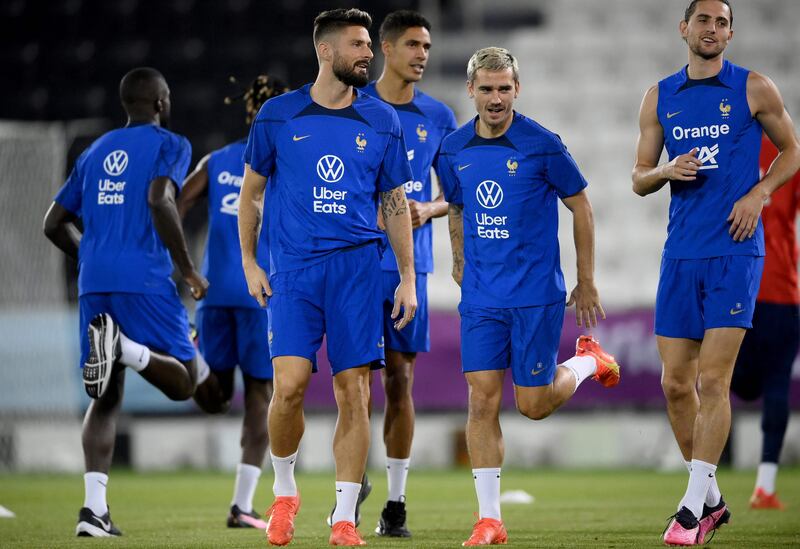 France's Olivier Giroud, Antoine Griezmann and Adrien Rabiot attend a training session at the Jassim-bin-Hamad Stadium. FP