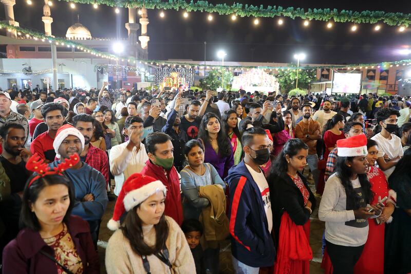 People during the Christmas midnight mass held at St Mary's Catholic Church in Dubai. Pawan Singh / The National