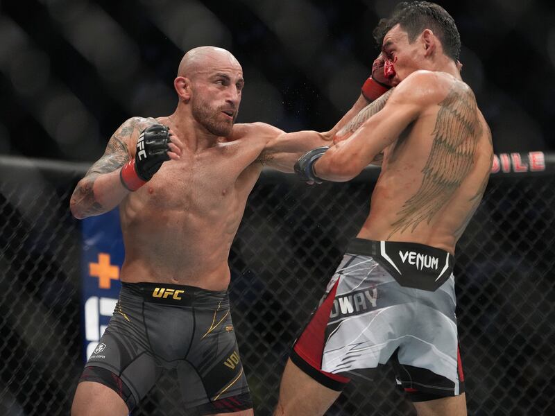 Alexander Volkanovski lands a punch on Max Holloway during their fight at UFC 276. Reuters