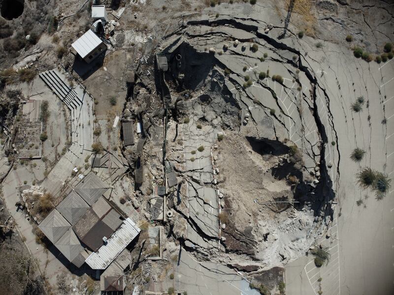 The Dead Sea is home to many sinkholes, such as this one that formed in a car park in Israel in 2020. 