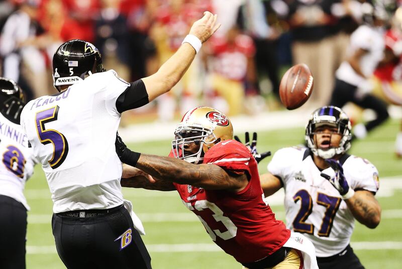 Joe Flacco #5 of the Baltimore Ravens throws a complete pass in the second half to Ray Rice #27 against NaVorro Bowman #53 of the San Francisco 49ers during Super Bowl XLVII at the Mercedes-Benz Superdome on February 3, 2013 in New Orleans, Louisiana.   Ronald Martinez/Getty Images/AFP== FOR NEWSPAPERS, INTERNET, TELCOS & TELEVISION USE ONLY ==
 *** Local Caption ***  407812-01-09.jpg