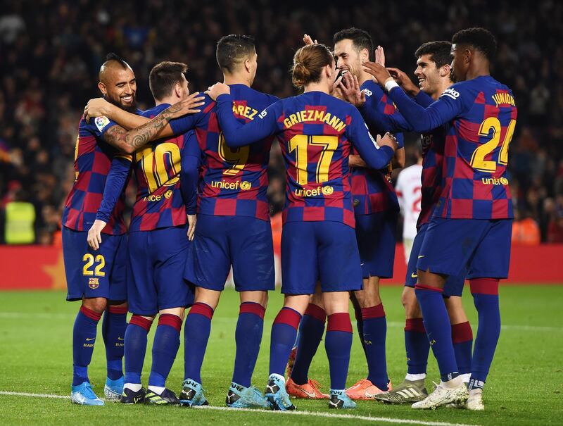 Messi and his Barca team-mates celebrate the fifth goal. Getty