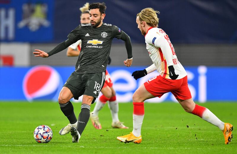 LEIPZIG, GERMANY - DECEMBER 08: Bruno Fernandes of Manchester United is challenged by Emil Forsberg of RB Leipzig during the UEFA Champions League Group H stage match between RB Leipzig and Manchester United at Red Bull Arena on December 08, 2020 in Leipzig, Germany. Sporting stadiums around Germany remain under strict restrictions due to the Coronavirus Pandemic as Government social distancing laws prohibit fans inside venues resulting in games being played behind closed doors. (Photo by Stuart Franklin/Getty Images)