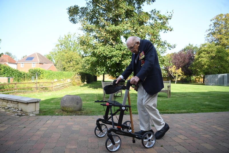 Captain Sir Tom Moore poses for photographers to promote the launch of his book 'Tomorrow is a Good Day' at his home in Bedfordshire, Britain. EPA