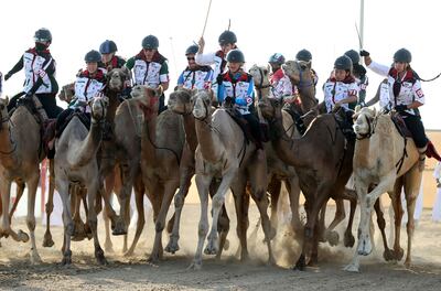 Camel jockeys battle it out at the Al Marmoon Race Track in Dubai. Chris Whiteoak / The National