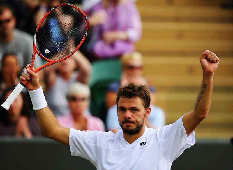 Stan Wawrinka of Switzerland celebrates after winning his third-round singles match against Denis Istomin on Monday at the 2014 Wimbledon Championships. Al Bello / Getty Images