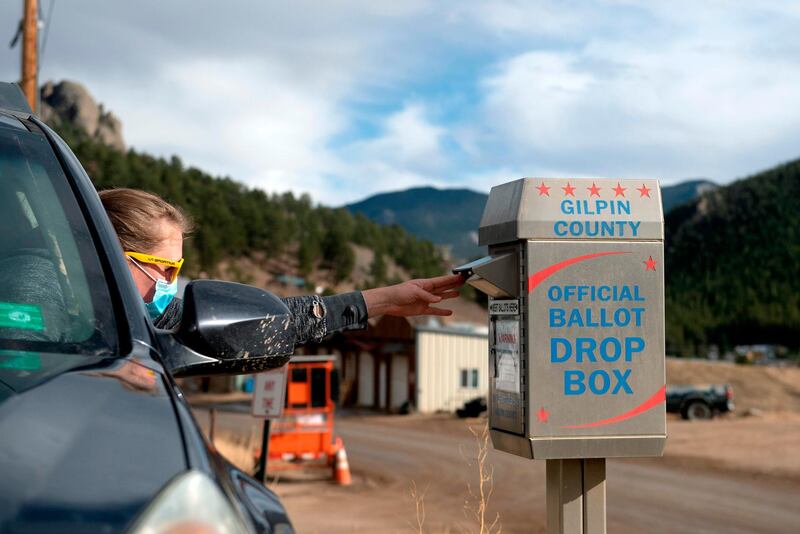 Steph Smith drops off her ballot for the US presidential election in Rollinsville, Colorado.  AFP