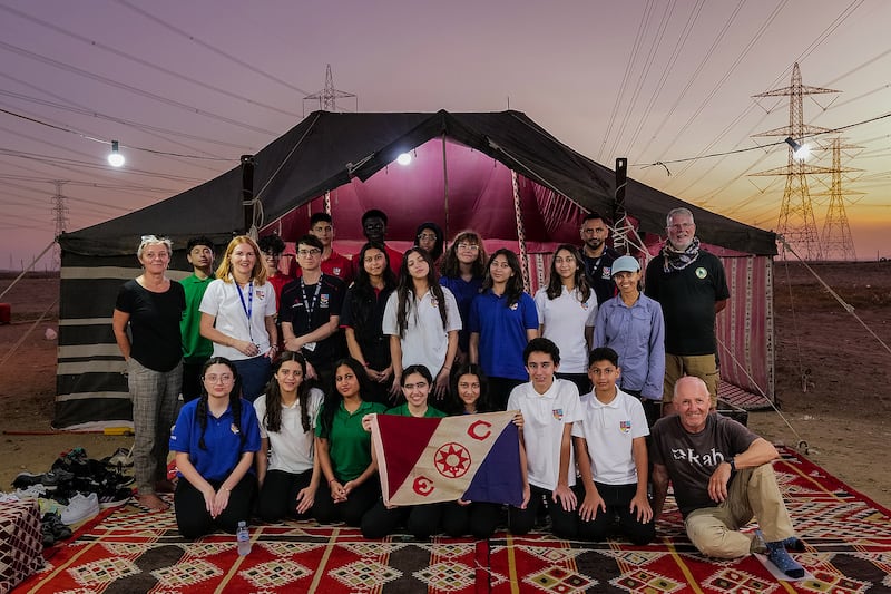 Pupils and teachers from Jeddah Prep and Grammar with the Heart of Arabia expedition team and The Explorers Club flag