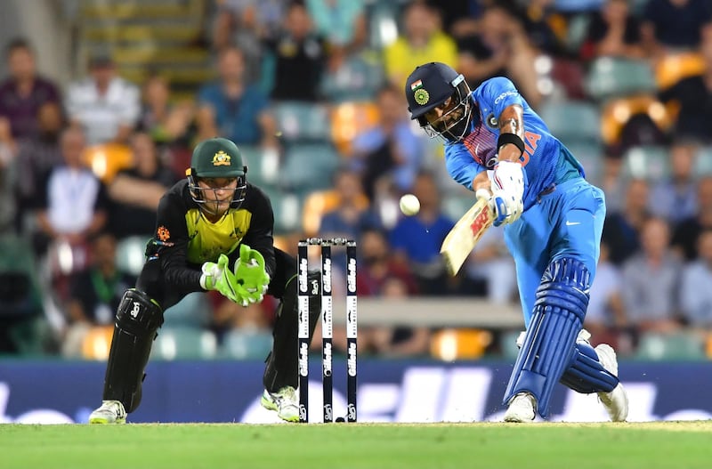 epa07181362 Virat Kohli (R) of India in action during the first Twenty20 (T20) International match between Australia and India at The Gabba in Brisbane, Australia, 21 November 2018.  EPA/DARREN ENGLAND NO ARCHIVING, EDITORIAL USE ONLY, IMAGES TO BE USED FOR NEWS REPORTING PURPOSES ONLY, NO COMMERCIAL USE WHATSOEVER, NO USE IN BOOKS WITHOUT PRIOR WRITTEN CONSENT FROM AAP AUSTRALIA AND NEW ZEALAND OUT