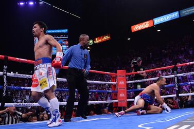 Manny Pacquiao, left, after kniocking down Keith Thurman in the first round. Reuters