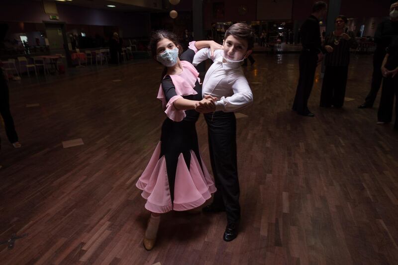 Serena Brunetti and Andrea Sterbini pose for a portrait after a practice session at the New Dancing Days association, Rome. While much of Italy is in coronavirus lockdown, competitive ballroom dancing is alive and well, albeit with precautions. AP Photo