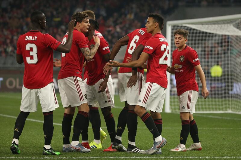 Manchester United players celebrate Mason Greenwood's strike. Getty