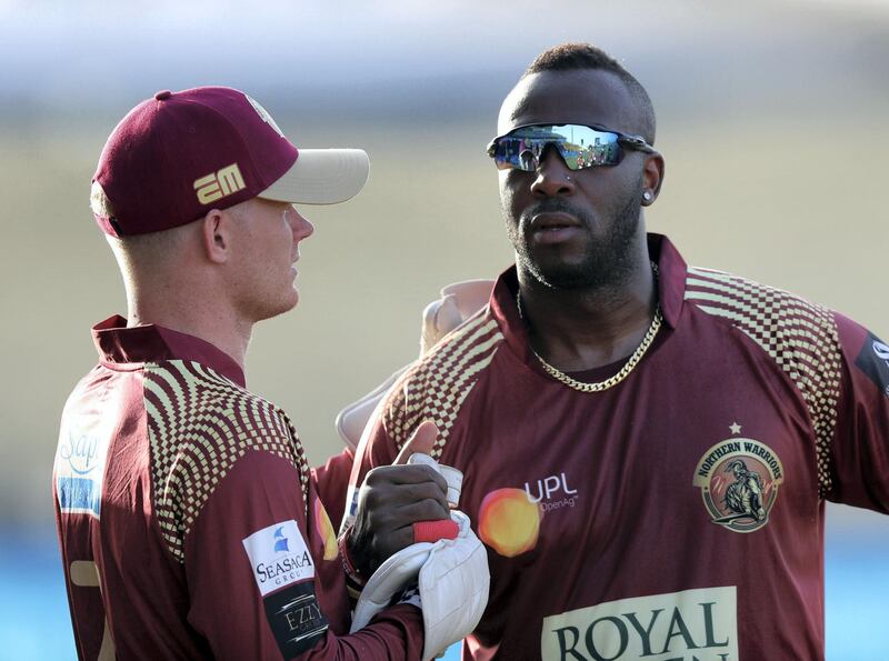 Abu Dhabi, United Arab Emirates - November 17, 2019: Northern Warriors' Andre Russell and Sam Billings (L) during the game between Team Abu Dhabi and The Northern Warriors in the Abu Dhabi T10 league. Sunday the 17th of November 2019. Zayed Cricket Stadium, Abu Dhabi. Chris Whiteoak / The National