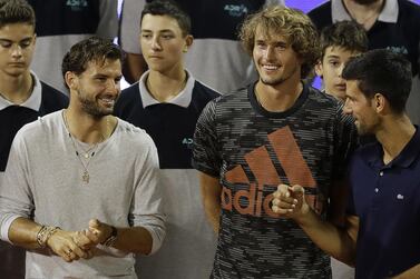 epa08485674 Alexander Zverev (C) of Germany, Grigor Dimitrov (L) of Bulgaria and Novak Djokovic (R) of Serbia chat after the final match at the Adria Tour tennis tournament in Belgrade, Serbia, 14 June 2020. The Adria Tour will be held until 05 July in a number of Balkan countries. EPA/ANDREJ CUKIC