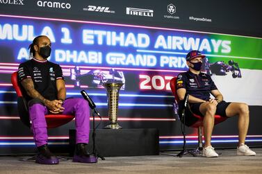 Mercedes' British driver Lewis Hamilton and Red Bull's Dutch driver Max Verstappen attend a press conference ahead of the Abu Dhabi Formula One Grand Prix at the Yas Marina Circuit in the Emirati city of Abu Dhabi on December 9, 2021.  (Photo by Antonin Vincent  /  POOL  /  AFP)