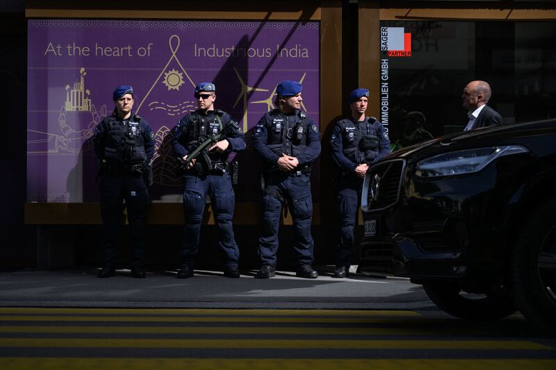 Swiss Police officers on guard on a street during the WEF annual meeting in Davos. AFP