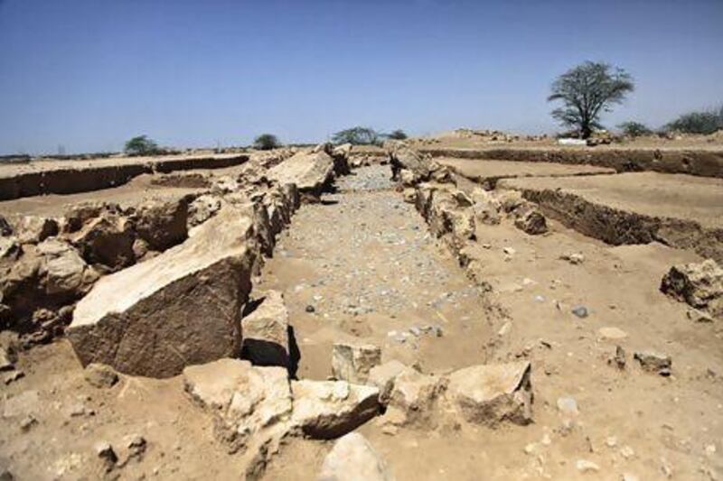 The excavated tombs are part of a fertile plain between Wadi Naqab and Wadi Al Baih that contains at least 60 tombs, field systems and houses first discovered in 1988 beside a rocky hill. Lee Hoagland / The National