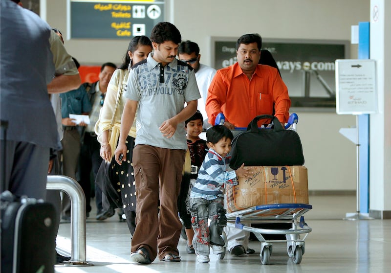 ABU DHABI, UNITED ARAB EMIRATES - August 24, 2008: Travelers with luggage bags at Abu Dhabi International Airport.

( Ryan Carter / The National )

 *** Local Caption ***  RC031-AirBlue.JPGRC031-AirBlue.JPGbz25mr-iata.jpgBZ23AU AD AIRPORT.jpg