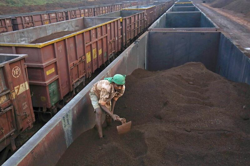 A worker levels the iron ore in a freight train at a railway station at Chitradurga in the southern Indian state of Karnataka. One of Narendra Modi’s main election planks is to crank up manufacturing to create millions of jobs by focusing on exporting steel, not iron ore. Danish Siddiqui / Reuters