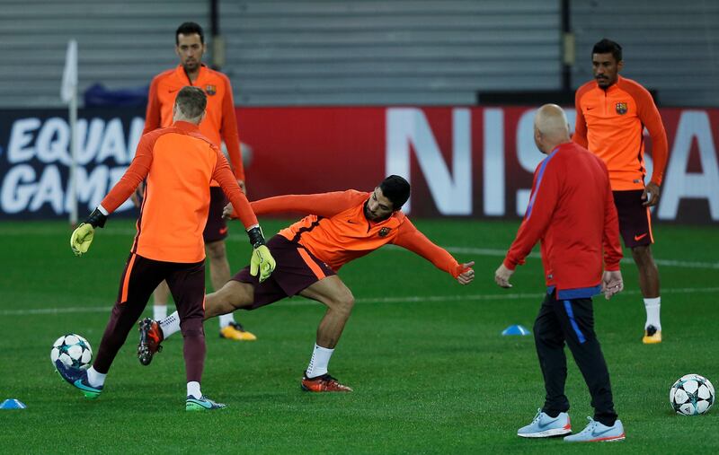 Luis Suarez attempts to get the ball during the training session. Costas Baltas / Reuters