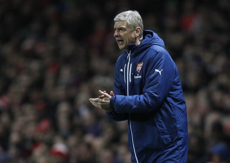 Arsenal’s manager Arsene Wenger urges on his side during their 1-0 win against Southampton last Wednesday. Ian Kington / AFP / December 3, 2014