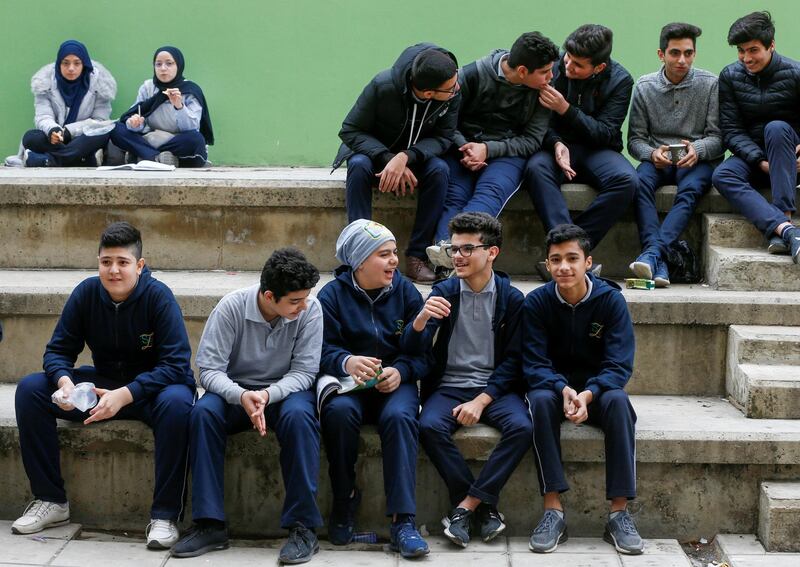 Students sit together during recess at a public school in Beirut, Lebanon December 12, 2019. Reuters
