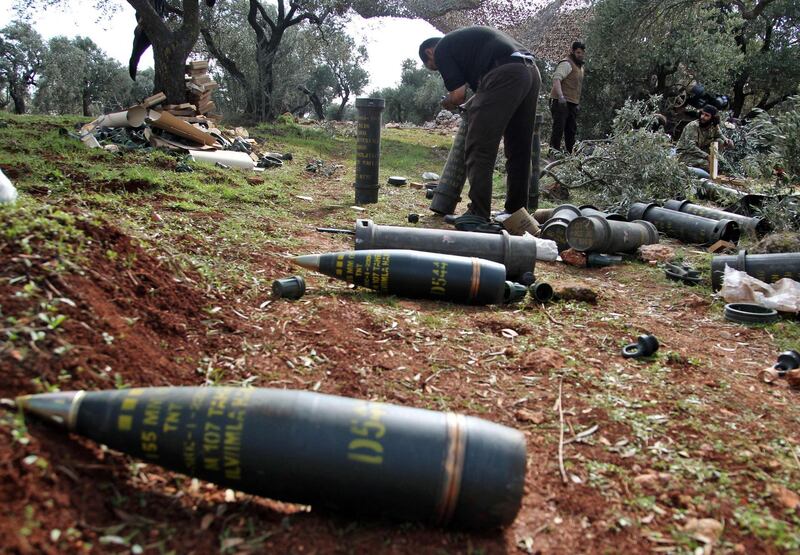 Turkish-backed Syrian fighters prepare to fire shells at a position near the village of al-Nayrab, about 14 kilometres southeast of the city of Idlib in northwestern Syria, amid clashes with government forces.   AFP